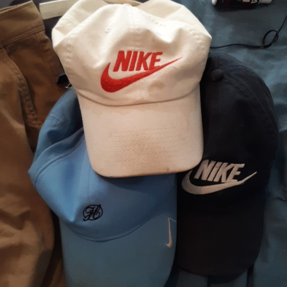 6 assorted brands of hats.